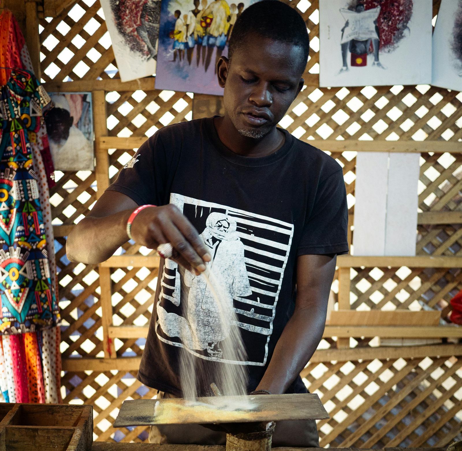 Screen printing work on a shirt in a production space