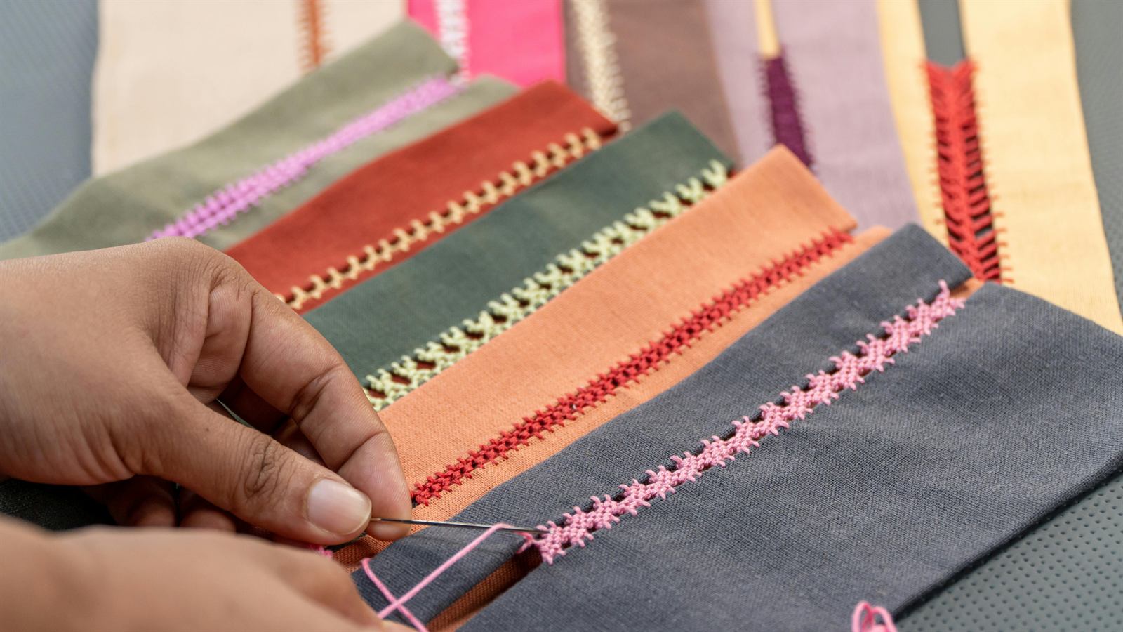 Worker handling printed fabric on a table